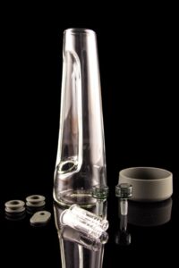 The Session Goods Modern Water Pipe, shown with accessories, has a sleek, aerodynamic design that just wants you to do a countdown and say "Liftoff!" every time you take a hit.