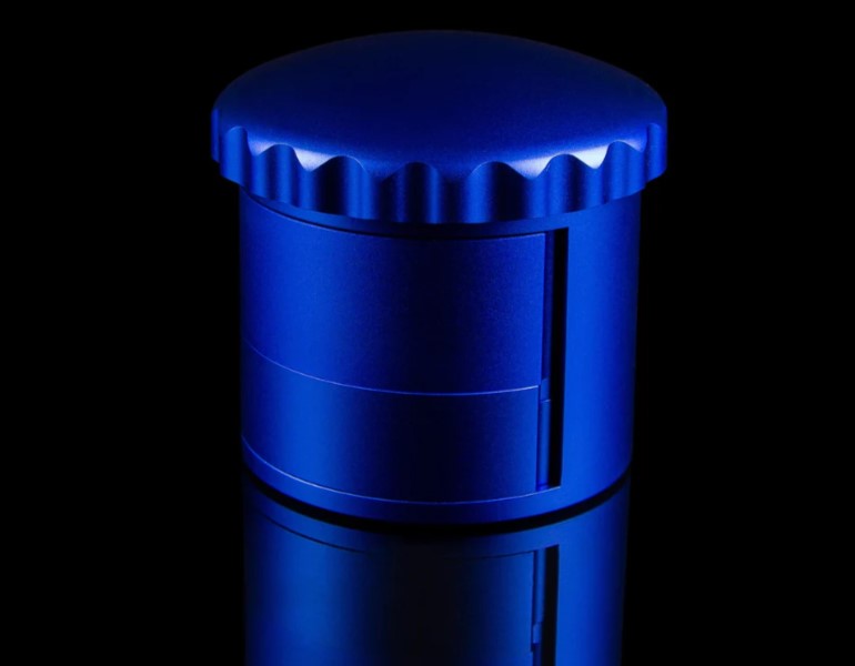 The Dr. Grind Aluminum Swing Tray Dry-herb Grinder in blue (tray closed)