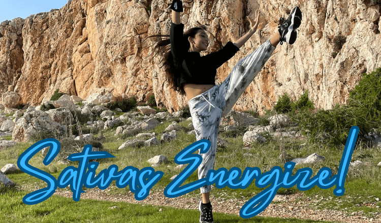 Young woman energized from smoking cannabis sativa dancing near a cliff.